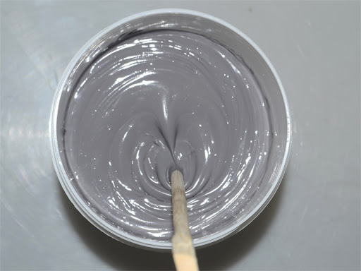 How does thermal paste help electronic devices dissipate heat?